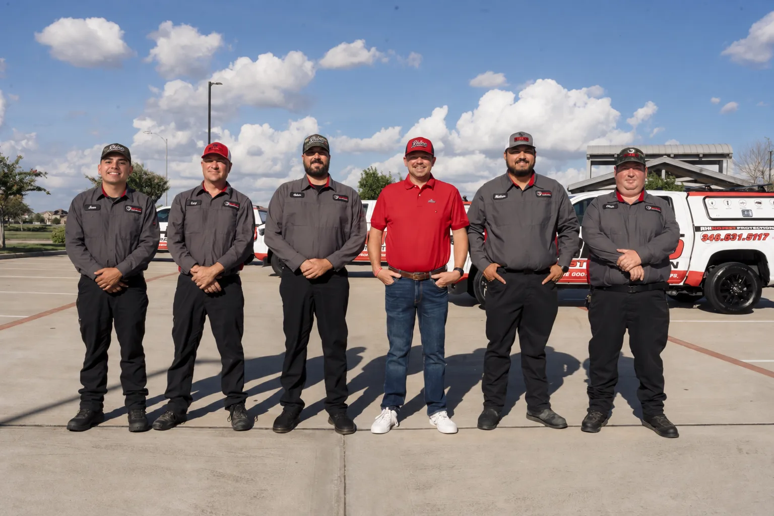 Gary Kirkowski with the Rhino Pest Protection crew in branded uniforms