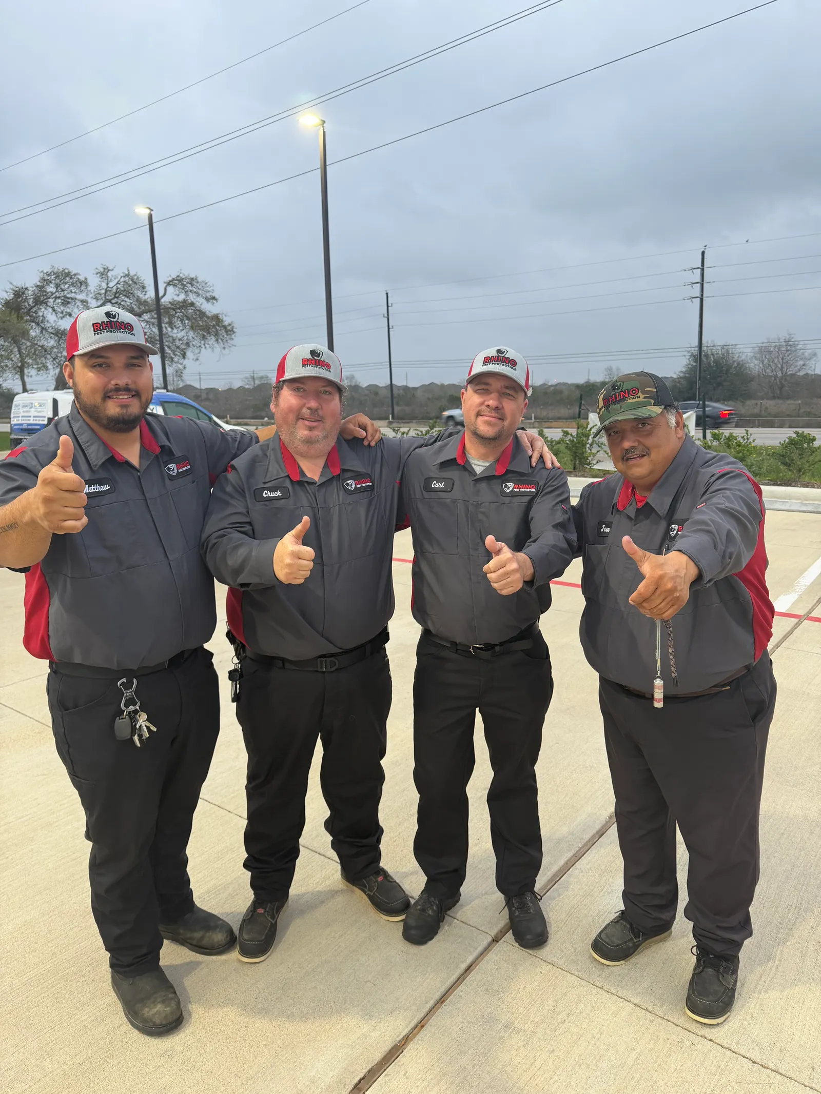 The Rhino Pest Protection crew in branded uniforms